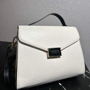 White Guess crossbody with long black shoulder strip brand new.